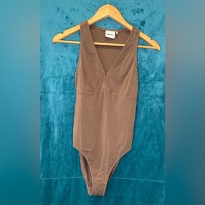 Richer poorer body suit